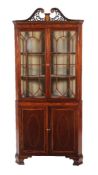 ϒ A mahogany and inlaid corner display cabinet