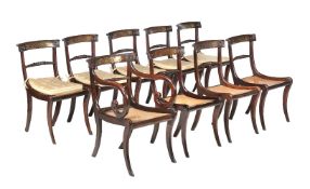 A set of nine Regency simulated rosewood and brass marquetry inlaid dining chairs