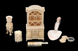 ϒ A carved bone model of a display cabinet