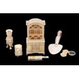 ϒ A carved bone model of a display cabinet
