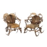 A pair of antler constructed throne chairs