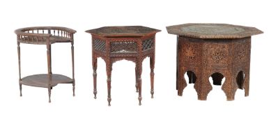 An Indian carved hardwood table with lattice sides