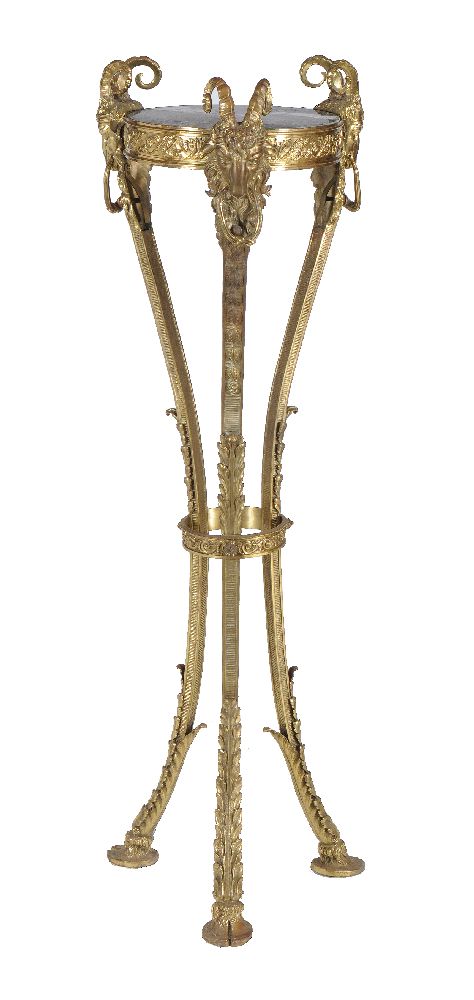 A gilt metal and marble inset torchere stand