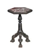 A carved and ebonised wood and marble mounted occasional table in Neoclassical style