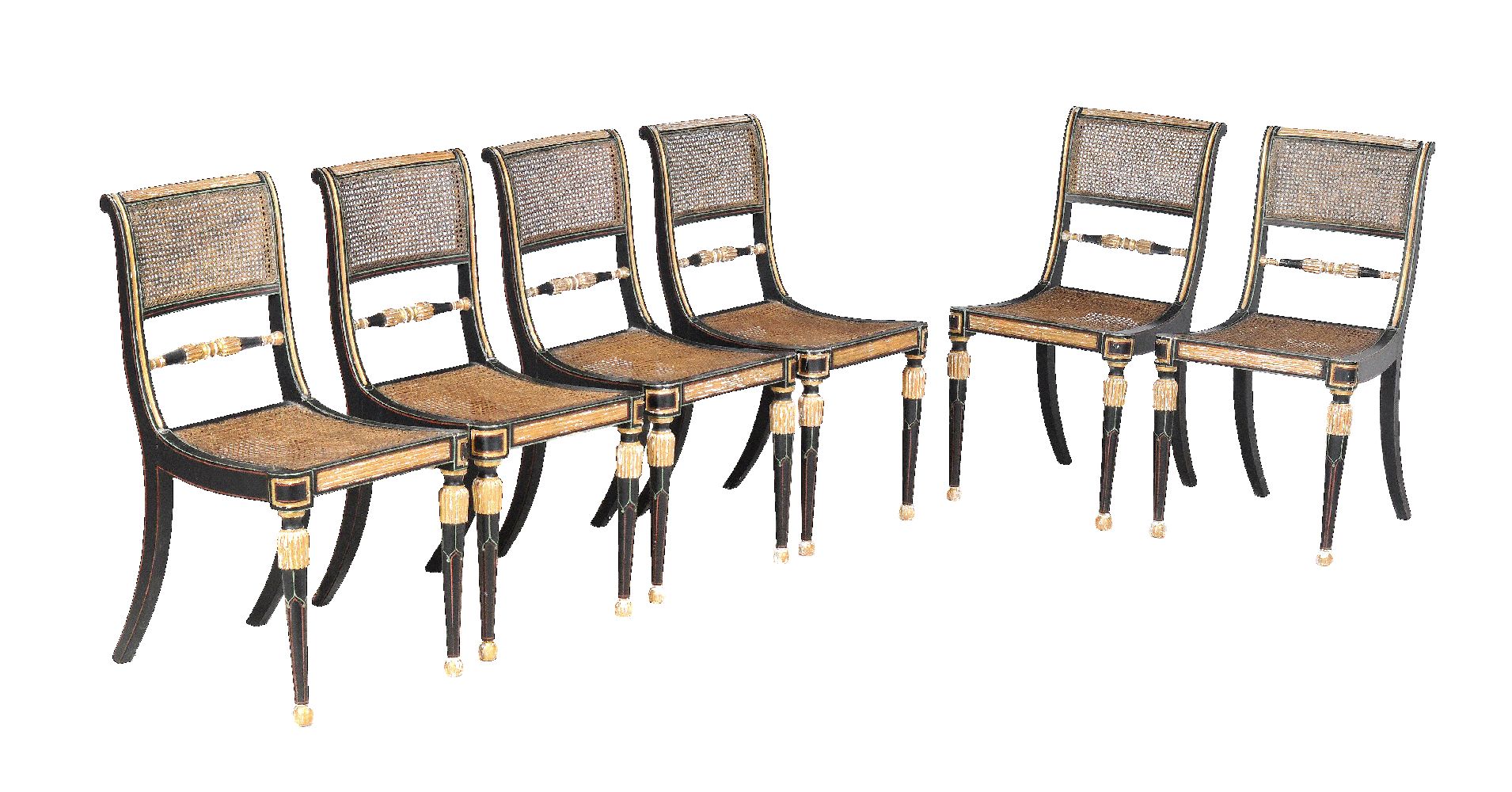 A set of six late George III ebonised and parcel gilt dining chairs