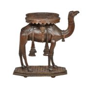 An Anglo-Indian carved teak occasional table modelled with a standing camel