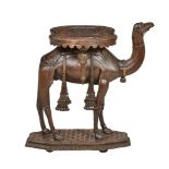 An Anglo-Indian carved teak occasional table modelled with a standing camel