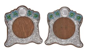 A matched pair of Art Nouveau silver photograph frames by E. Mander & Son