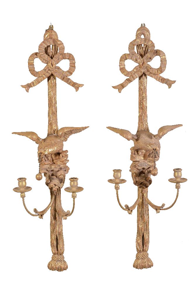 A pair of carved and giltwood twin light wall appliques in Regency/Empire taste