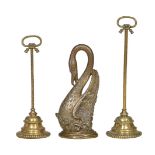 Two similar early Victorian brass door porters