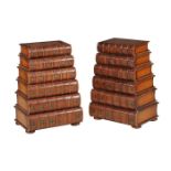 A pair of bedside chests in the form of six false book bindings