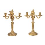 A pair of gilt bronze three light candelabra in Louis XVI style