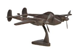 A patinated metal display model of the North American Lockheed P-38 Lightning twin fuselage fighter