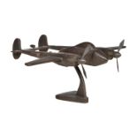 A patinated metal display model of the North American Lockheed P-38 Lightning twin fuselage fighter