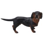 An Austrian painted terracotta model of a standing dachshund