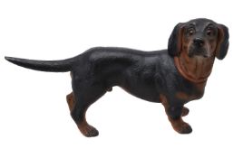 An Austrian painted terracotta model of a standing dachshund