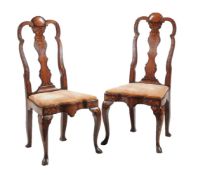 A pair of Dutch mahogany and marquetry inlaid side chairs in early 18th century style