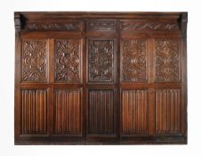 A carved oak panel in 17th century style