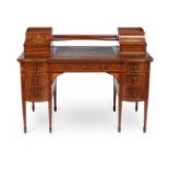 ϒ An Edwardian mahogany and specimen marquetry desk by EDWARDS & ROBERTS