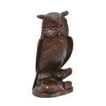 A 'Black Forest' carved and stained wood tobacco jar modelled as an owl