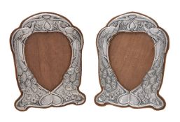 A pair of Arts and Crafts silver photograph frames by Henry Matthews