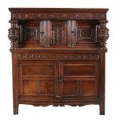 A carved oak court cupboard