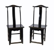 A pair of Chinese black lacquer chairs in Ming style