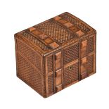 A carved walnut tea caddy