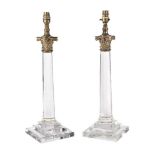 A pair of gilt metal mounted moulded and cut glass columnar table lamps