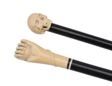 ϒ Two late Victorian or Edwardian carved ivory and ebonised wood walking sticks