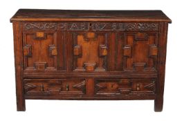 A carved oak mule chest