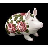 A Wemyss (Plicta) model of a pig painted by Joseph Nekola with roses