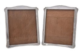 A pair of silver photograph frames