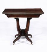 A Regency mahogany and gilt brass mounted folding card table