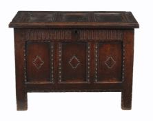 A Charles II carved oak triple paneled coffer