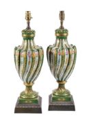 A pair of Limoges porcelain spirally fluted green-ground and gilt urn-shaped lamp bases