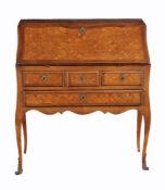 A mahogany and parquetry inlaid bureau de dame in Louis XVI style