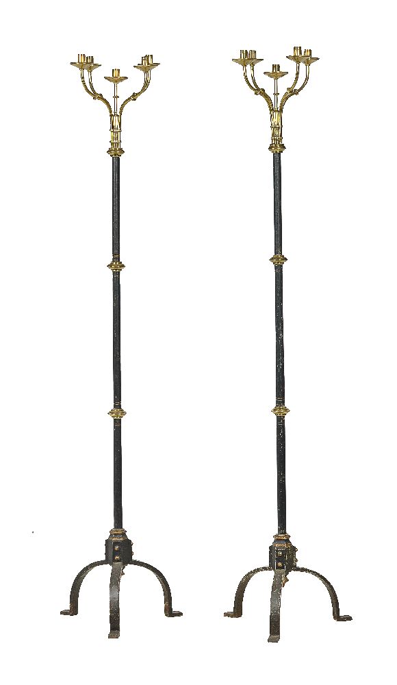 A pair of brass mounted and painted cast iron five light standard lamps