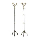 A pair of brass mounted and painted cast iron five light standard lamps