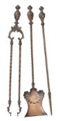 A set of late Victorian metal fire tools in Rococo Revival taste