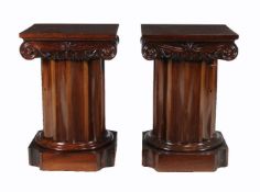 A pair of mahogany pedestal cupboards