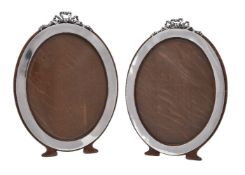 A matched pair of silver oval photograph frames