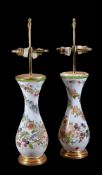 A pair of French opaque-white glass and enamelled pear-shaped vases with gilt-wood mounts