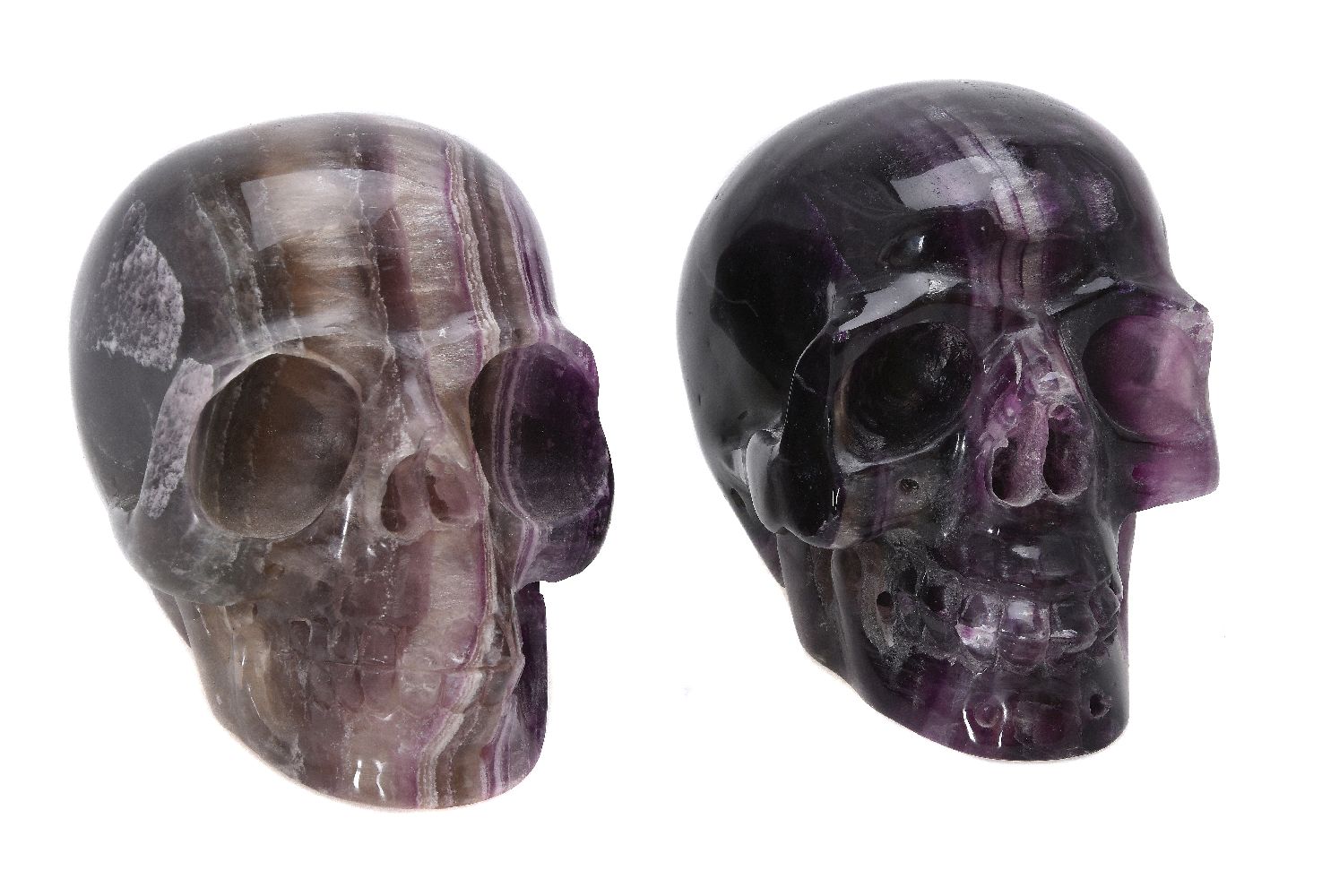 Two carved fluorspar (fluorite) models of human skulls