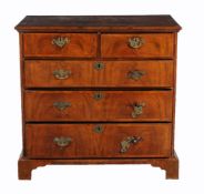 A walnut chest of drawers