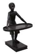 A carved and ebonised wood stand modelled as a Blackamoor in 17th century taste