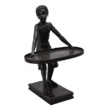 A carved and ebonised wood stand modelled as a Blackamoor in 17th century taste