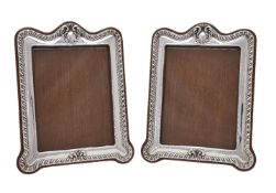 A pair of Edwardian silver photograph frames by William Neale & Son