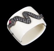 A resin, diamond and ruby snake bangle