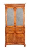 A walnut veneered secretaire cabinet in George II style